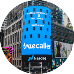 the nasdaq billboard on Times Square showing the truecaller logotype along with "Nasdaq Stockholm Welcomes Truecaller"